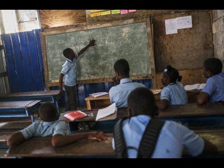 Credit: (AP Photo/Matias Delacroix, File) Students attend a French writing class at the Wesleyenne Regard Divin co-ed primary and middle school in Port-au-Prince, Haiti, Thursday, October 28, 2021.