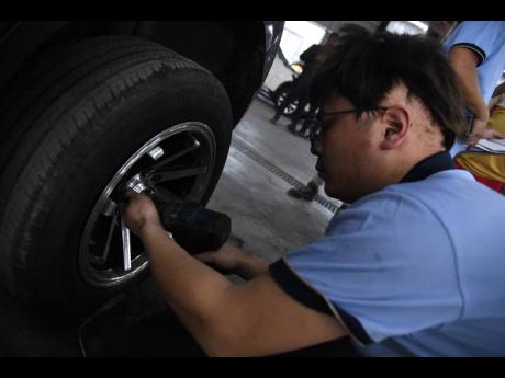 Jong Zhangcanqiang working on a vehicle on Tuesday.