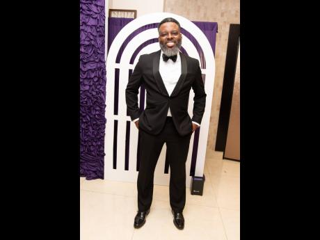 First Global Bank Liguanea Branch Manager Ricardo Gooden is dapper in his black tux.