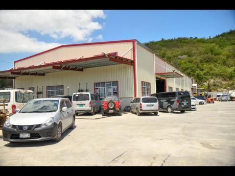 Credit: Matthew McKoy This photo shows the Chinese car servicing garage, WH Car Service in Ferry, St Catherine