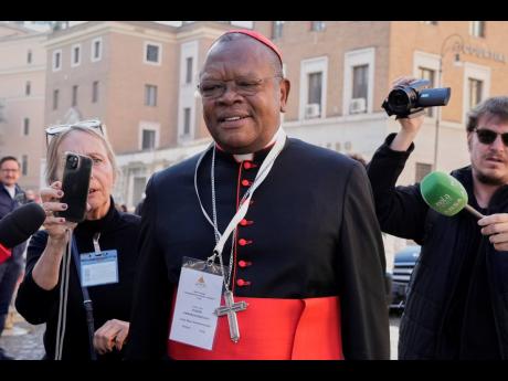Cardinal Fridolin Ambongo Besungu arrives for a college of cardinals' meeting, at the Vatican, Wednesday, April 30, 2025.