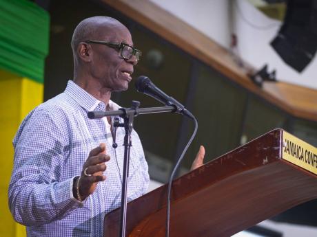 Credit: JIS News Minister of Local Government and Community Development, Desmond McKenzie, addressing employees of the Social Development Commission during the agency’s inaugural National Staff Summit. The event was held at the Jamaica Conference Centre in downtown Kin