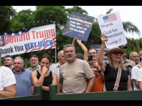 White South Africans demonstrate in support of US President Donald Trump in front of the US Embassy in Pretoria, South Africa, February15, 2025. (AP Photo/Jerome Delay, File)
