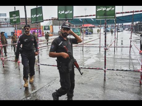 Credit: AP Police officers stand guard at an entry point to Pindi Cricket Stadium following the crash of a suspected Indian drone in the parking area, in Rawalpindi, Pakistan, last Thursday.