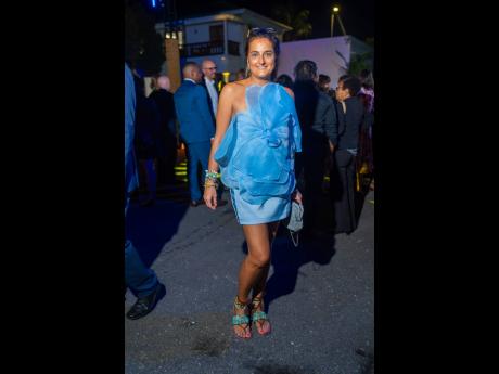Credit: Contributed IDB Procurement Specialist Veronica Benedettelli boasts a blue mini dress, blooming with oversized petal details.