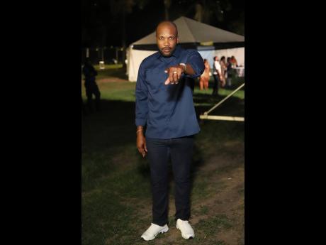 Credit: Contributed Commanding and classic in navy, Agent Sasco pauses backstage for a quick snap.