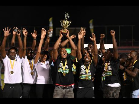Members of the August Town FC team celebrate after capturing the 2024 KSAFA Major League title  at the Anthony Spaulding Sports Complex on Sunday, May 26, 2024.