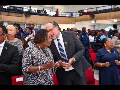 Olivia Grange, minister of culture, gender, entertainment and sport, who was representing the prime minister, engaged in conversation with Opposition Leader Mark Golding during the Worker’s Week & Labour Day Thanksgiving Church Service hosted by the Port
