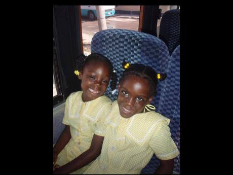 The pair on a school trip during their time at the DRB Grant Demonstration Basic School in St James. 