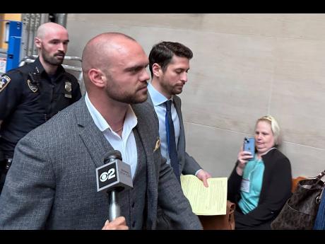 Credit: Former New York state trooper Thomas Mascia leaves Nassau County court in Mineola, NY on Wednesday, May 21, 2025, after pleading guilty to charges that he shot himself and lied about it. (AP Photo/Philip Marcelo)