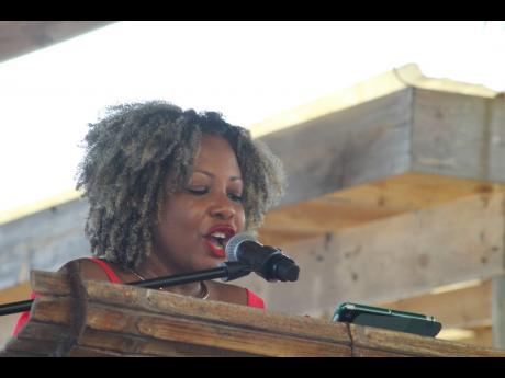 Credit: Paul Williams Minister of Education, Skill, Youth and Information Senator Dr Dana Morris Dixon reads a chapter from ‘Annie John’, by Jamaica Kincaid, on Sunday, May 25.