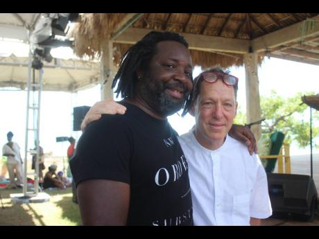 Credit: Paul Williams Multi-award-winning writer Marlon James (left), and writer Paul Holdengraber, embrace after their well-received and engaging conversation on Saturday, May 24,