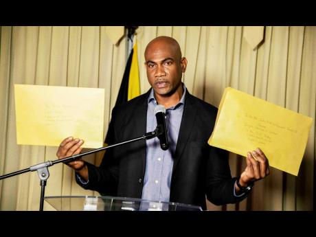 Credit: Antoine Lodge Dr Alfred Dawes, opposition spokesperson on health and wellness, addressing a press conference at the Office of the Leader of Opposition on May 20.