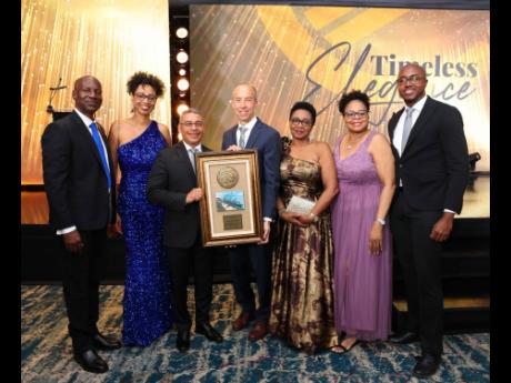 Credit: Kingston Wharves Limited (KWL) presents officials of Höegh Autoliners with a Solid Alliance Award for that company’s collaboration in its auto transshipment business. KWL’s CEO Mark Williams (left) shares in the moment with Höegh’s trade manager, S