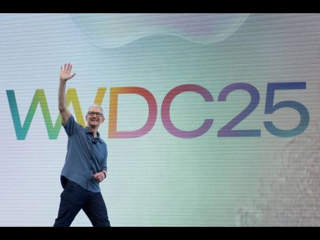 Apple CEO Tim Cook waves to attendees during an event on the Apple campus in Cupertino, California, on Monday, June 9, 2025.