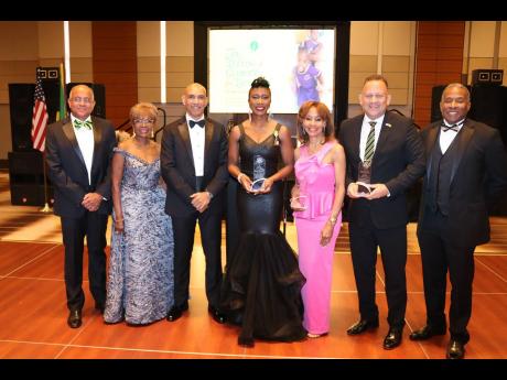 Credit: Derrick Scott Major General (Ret’d) Antony Anderson (third from left), the Jamaican Ambassador to the United States, shares a light moment with (from left) President of the Integrity Children’s Fund Major (Ret’d) Karl Chambers, Marcia Chambers, 2025 honourees Exe
