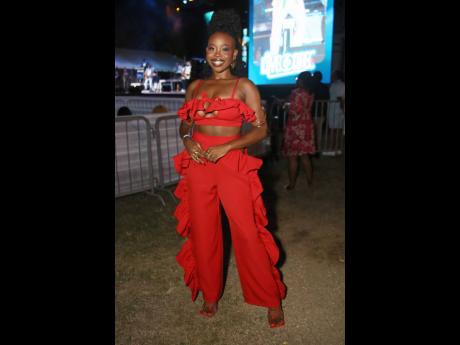 Joby Jay captivated on stage in both vocals and this striking red outfit she copped from Rhea Imani.