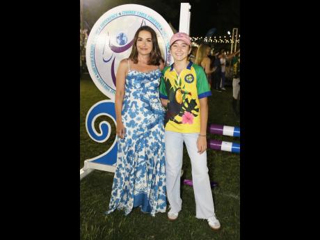 Credit: Nathaniel Stewart Executive director of JustWorld International, Elena Corsano (left), beams with joy alongside equestrian ambassador Savana Lue, a promising young rider who participated in the ‘Night Under the Stars’ showcase at Kingston Polo Club, Caymanas.