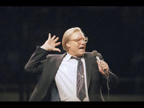 Credit: Mark Avery The Rev Jimmy Swaggart gestures as he preaches the gospel to the nearly 14,000 faithful who attended his Los Angeles Crusade in the Sports Arena on Sunday, March 29, 1987.