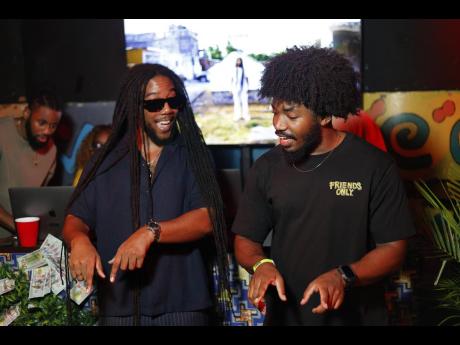 Credit: Contributed Royal Blu shares a moment with producer J.L.L as he introduced one of the songs on his album.