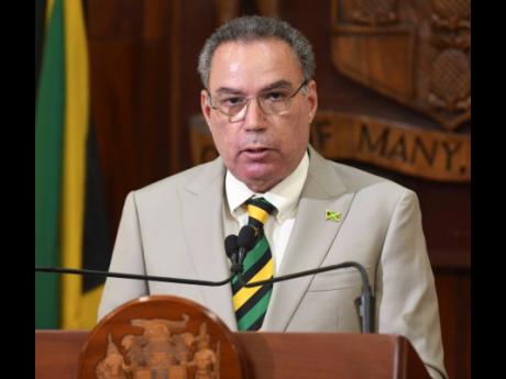 Energy Minister Daryl Vaz addressing a press conference on Tuesday.