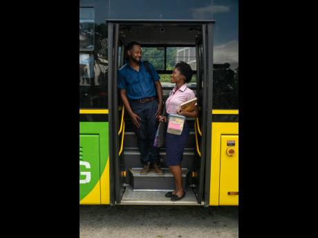 Credit: Contributed Anna-Sharé ‘Sevana’ Blake and Shomari Downer prepare for a key scene on a Jamaica Urban Transit Company Limited bus for the Jamaican film, ‘Threads of Us’.