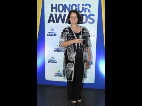 Credit: Antoine Lodge Doris Gross, creative director of Kingston Creative, radiates regal glamour ahead of the televised event.