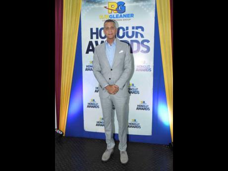 Credit: Antoine Lodge Director of the RJRGLEANER Communications Group, Peter Melhado, made a fashionable statement at the company’s Honour Awards in grey, complemented by a light hue of blue.