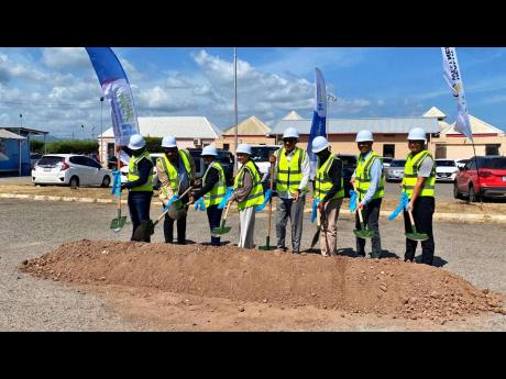 Health and Wellness Minister Dr Christopher Tufton (fourth right) is accompanied by Jamaica’s chief medical officer Jacquiline Bisasor-McKenzie (fourth left), representatives of the Southern Regional Health Authority and other stakeholders as they break 