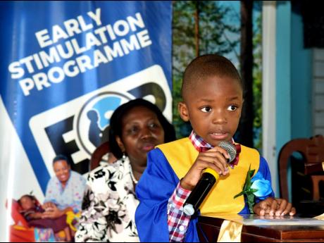 Credit: JIS At the podium, Suewayne Watson, one of the 74 graduates of the Early Stimulation Programme (ESP), delivers the valedictorian speech during the ESP’ graduation ceremony held on July 9, at the Apostolic Church of Jamaica, Bethel Temple, in downtown Kingsto
