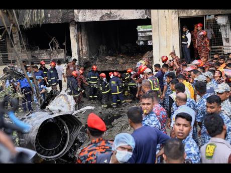 Credit: Firemen look for the survivors after a Bangladesh Air Force training aircraft crashed onto a school campus shortly after takeoff in Dhaka, Bangladesh, Monday, July 21, 2025. (AP Photo/Mahmud Hossain Opu)
