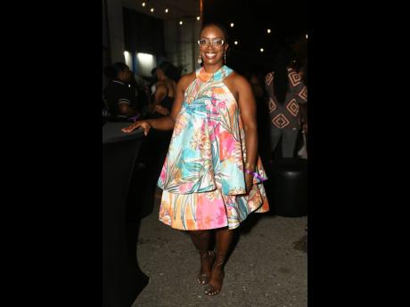 Credit: Nathaniel Stewart Aisha Campbell, chief executive officer, PROVEN Properties, catches our attention in this tropical print two-tiered dress.