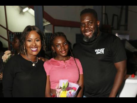 Credit: Nathaniel Stewart Odean White, chief risk officer at the Bank of Jamaica, and his wife Alysia, CEO of WhatBox Group Ltd, come bearing flowers and full hearts as they greet their daughter Amaris.