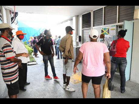Credit: File In this September 2020 photo, voters are seen gathered outside the polling station in St. Andrew East Central on Thursday.
