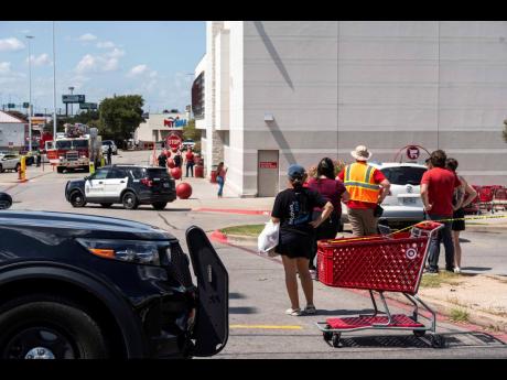 Credit: Law enforcement investigates a shooting at Target off Research Boulevard, near Ohlen Road in Austin, Texas, Monday, August 11, 2025. (Mikala Compton/Austin American-Statesman via AP)