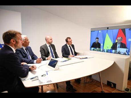 French President Emmanuel Macron, left, Antonio Costa, President of the European Council, second left, French Foreign Minister Jean-Noel Barrot, third right, and French Defence Minister Sebastien Lecornu, attend a video conference on Ukraine at the Fort de