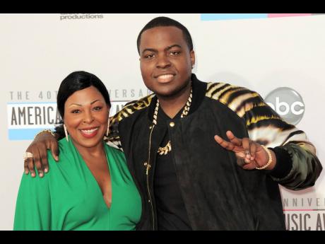 Sean Kingston, right, and his mother Janice Turner arrive at the 40th anniversary American Music Awards, November 18, 2012, in Los Angeles. (Photo by Jordan Strauss/Invision/AP, File)