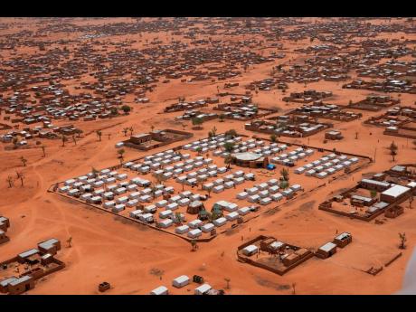 Credit: AP FILE- An aerial view shows a camp of internally displaced people in Djibo, Burkina Faso, May 26, 2022. Mali, along with neighbouring Burkina Faso and Niger, has long battled an insurgency by armed militants, including some allied with al-Qaida and the Isla
