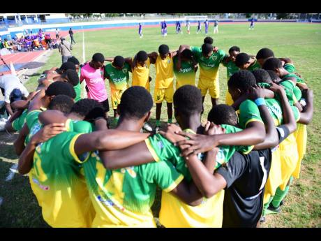 Gladstone Taylor/Multimedia Photo Editor 
Excelsior High School’s players huddle during a previous iteration of the ISSA Manning Cup competition.