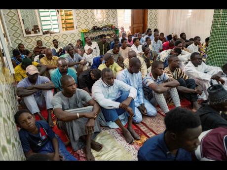 Credit: AP Worshippers listen to Imam Ibrahima Diane, advocate for an end to gender-based violence and practices like female genital mutilation, deliver his sermon at the Great Mosque of Nietty Mbar in Thiaroye, a suburb of Dakar, Senegal.
