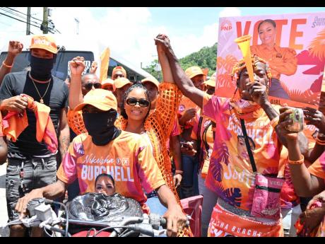 Credit: Ashley Anguin/Photographer Nekeisha Burchell, People’s National Party candidate for St James Southern, arrives on an ATV on her way to the Cambridge Resource Centre on Nomination Day on Monday.