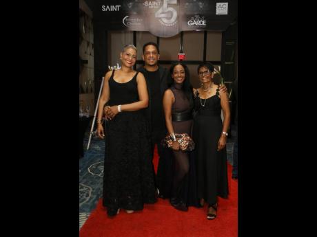 Credit: Nathaniel Stewart Out to support Prestley Hart, the new SAINT’s Male Fashion Face winner, are (from left) mother Shauna Gaye-Hart, owner of Puzzles by SG; father Orrett ‘DJ Bambino’ Hart; aunt Kerry-Ann Clarke, co-proprietor of Locale boutique; and grandmother Doroth