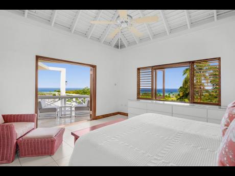 The airy bedrooms open up to scenic sights and a constant breeze from the sea and golf course below.