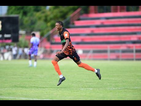 Credit: Gladstone Taylor Tivoli Gardens’ Nickalia Fuller celebrates a goal against Dunbeholden FC during a 2-0 Lynk Cup win for his team at the Anthony Spaulding Sports Complex.