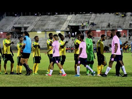 Jamaica and Bermuda players bumped elbows as a precautionary measure against COVID-19 before kick-off of their International Friendly match at the Montego Bay Sports Complex on Wednesday, March 11, 2020. The Reggae Boyz won 2-0.