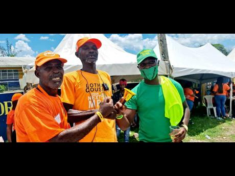 From left: Asford Brown,  Nicholas Bailey and John Watson outside the polling station at Osbourne Store Primary in Clarendon South Western.