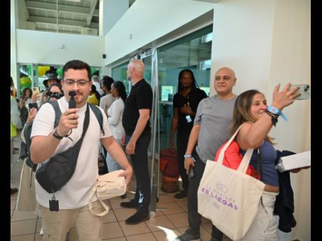 Passengers arrive at the Sangster International Airport in Montego Bay, St James, on one of the two Wingo Airlines inaugural mystery flights from Colombia in Latin America to Jamaica on Thursday.