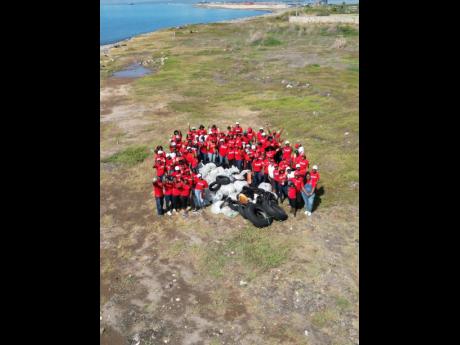 Scotia Foundation volunteers pose proudly after removing 138 bags of waste and recyclables from the coastline during their activities for International Coastal Cleanup Day.