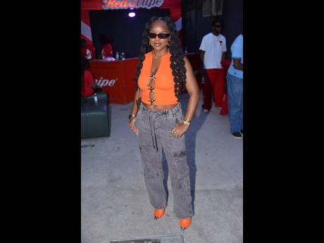 Credit: Antoine Lodge Khalia, who recently released a single called ‘Jamaica’ featuring Jahshii, said she couldn’t miss this event and had to show support for Naomi Cowan. The fellow entertainer shows off her cool and edgy sense of style in an orange cutout top, washed bl