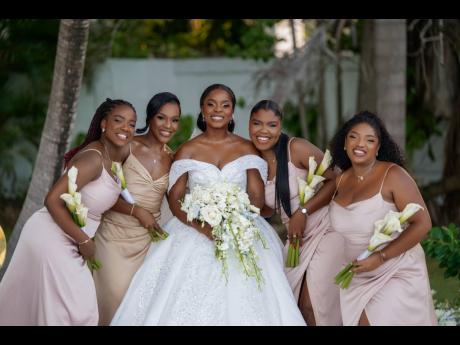 Sherona (centre) and her beautiful bridal party (from left) Joelle Notice-Barnett; maid of honour Shanna-kaye Forrester; Britney Getfield and Zaneek Wright.